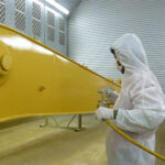One Coat High Build Steel Enamel being sprayed onto metal