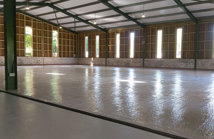 Two pack epoxy floor paint top coat applied to a warehouse floor